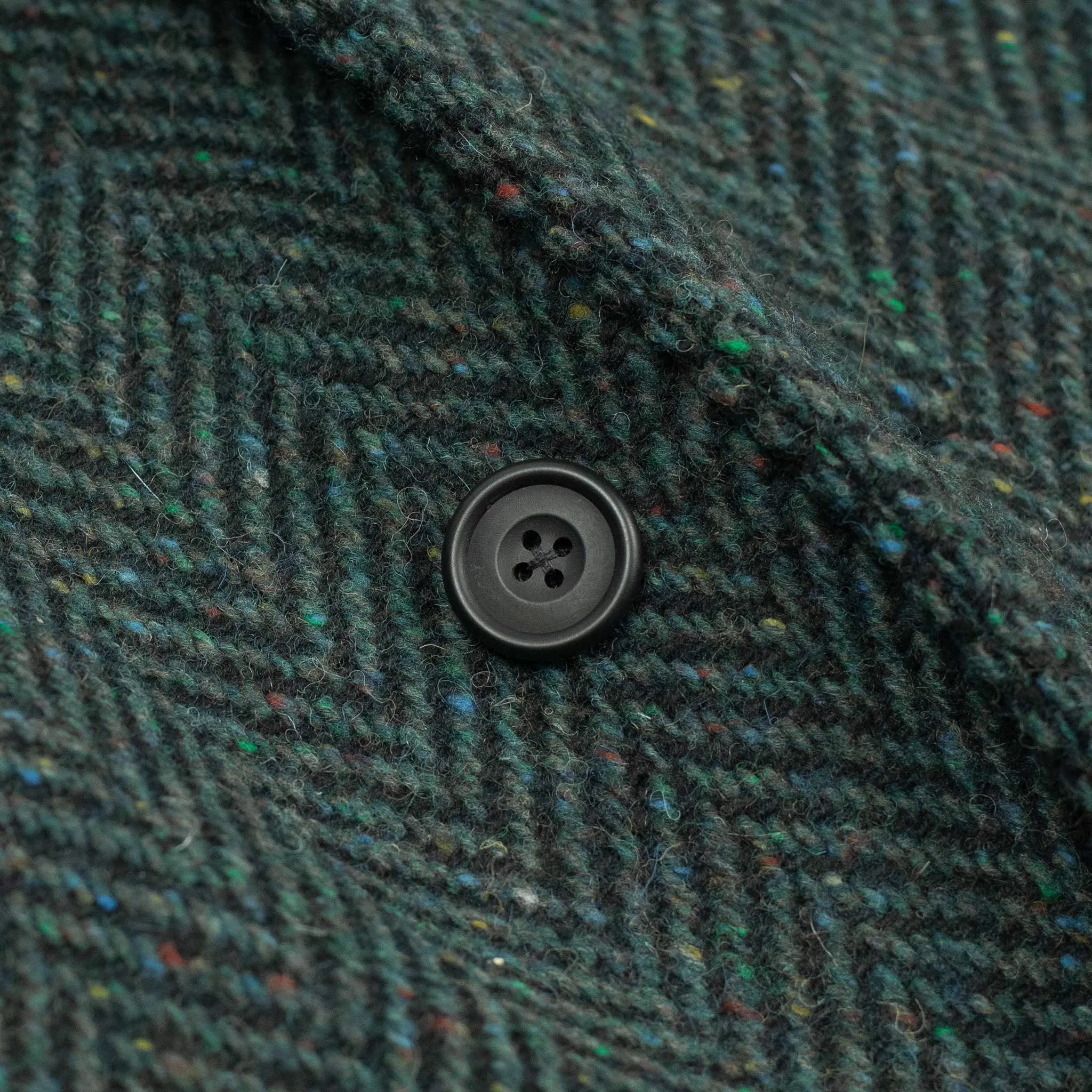 Belted balmacaan coat in handloomed Donegal blue-green herringbone tweed